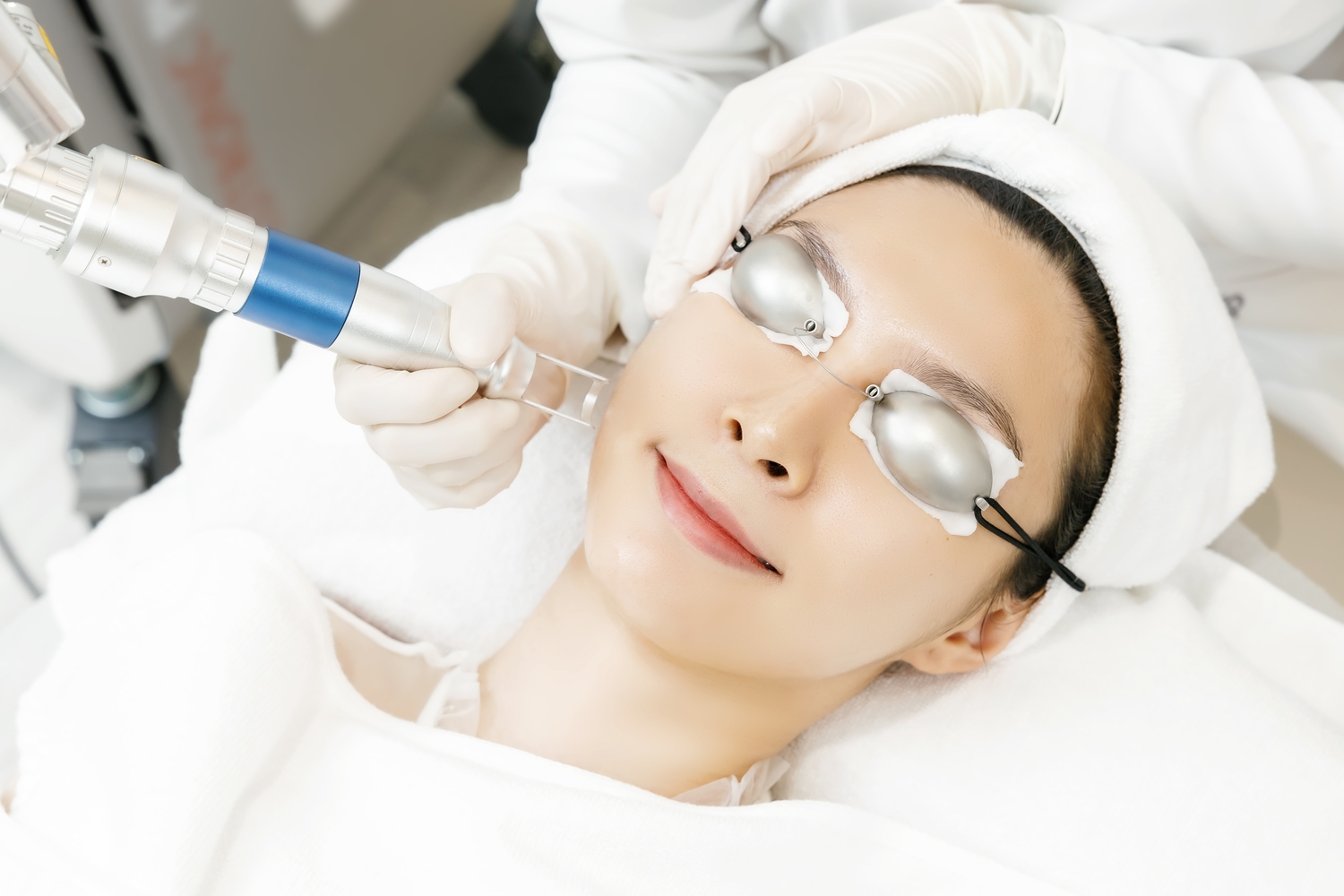 Relaxed,Asian,Woman,Wearing,Protection,Glasses,Getting,Laser,Skin,Procedures